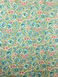 Wrapping paper from Florence in Italy with an intricate, aqua, floral pattern. Perfect for wrapping gifts or crafts.